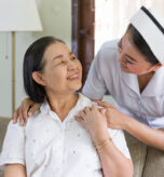 asian-nurse-caring-carefully-comforting-elderly-pa-2026-01-11-09-52-41-utc